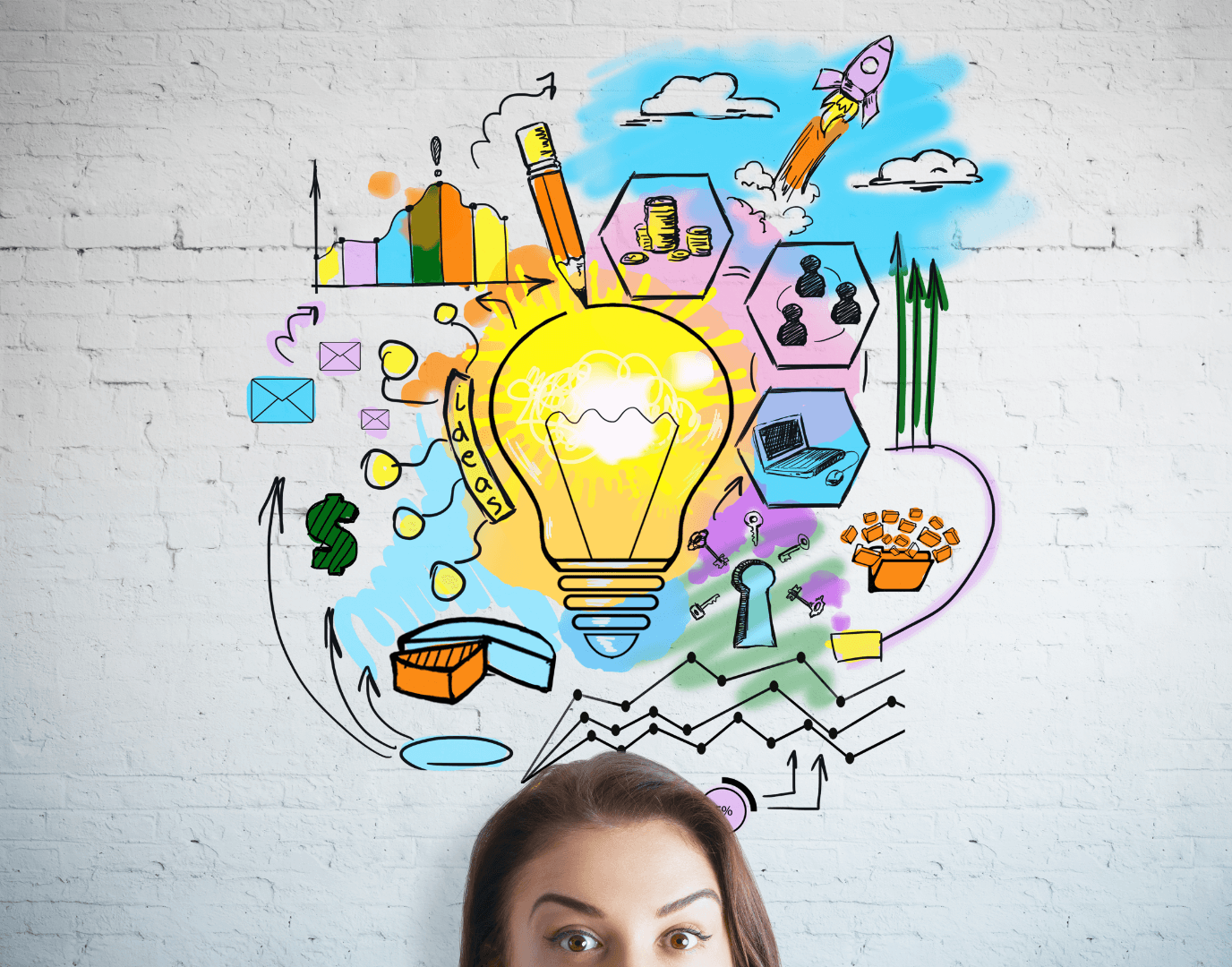 A woman looks up at a vibrant, hand-drawn business doodle on a white brick wall, featuring a central glowing lightbulb surrounded by icons of a rocket, laptop, team, and growth charts