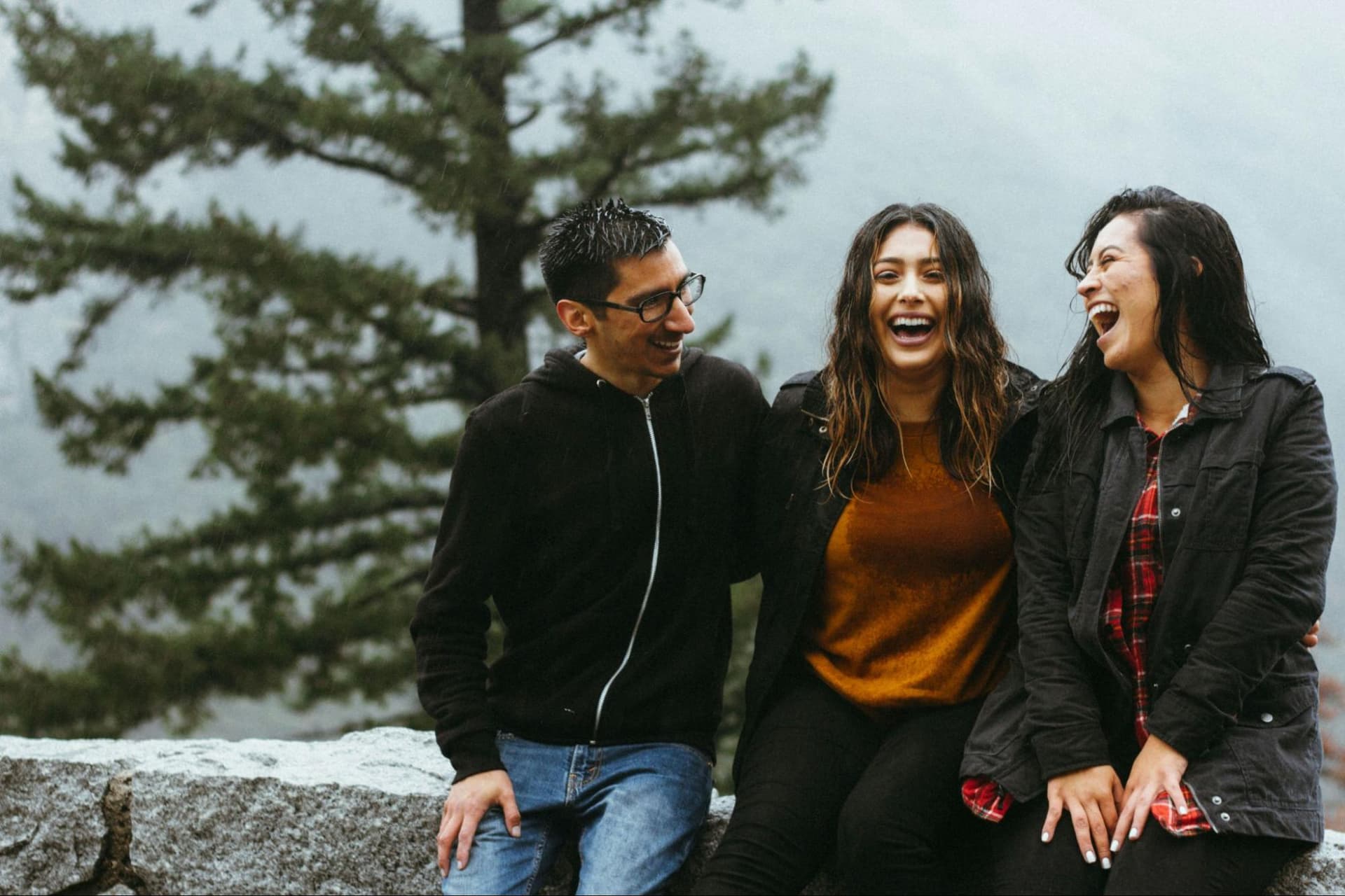 Three friends laughing together