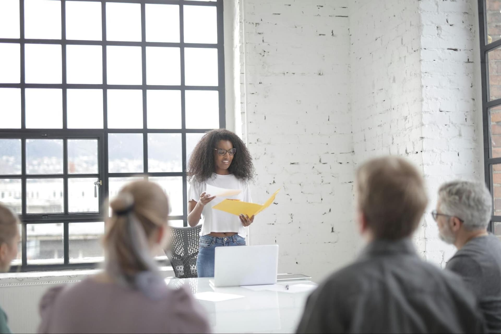 A woman doing a presentation in an office setting